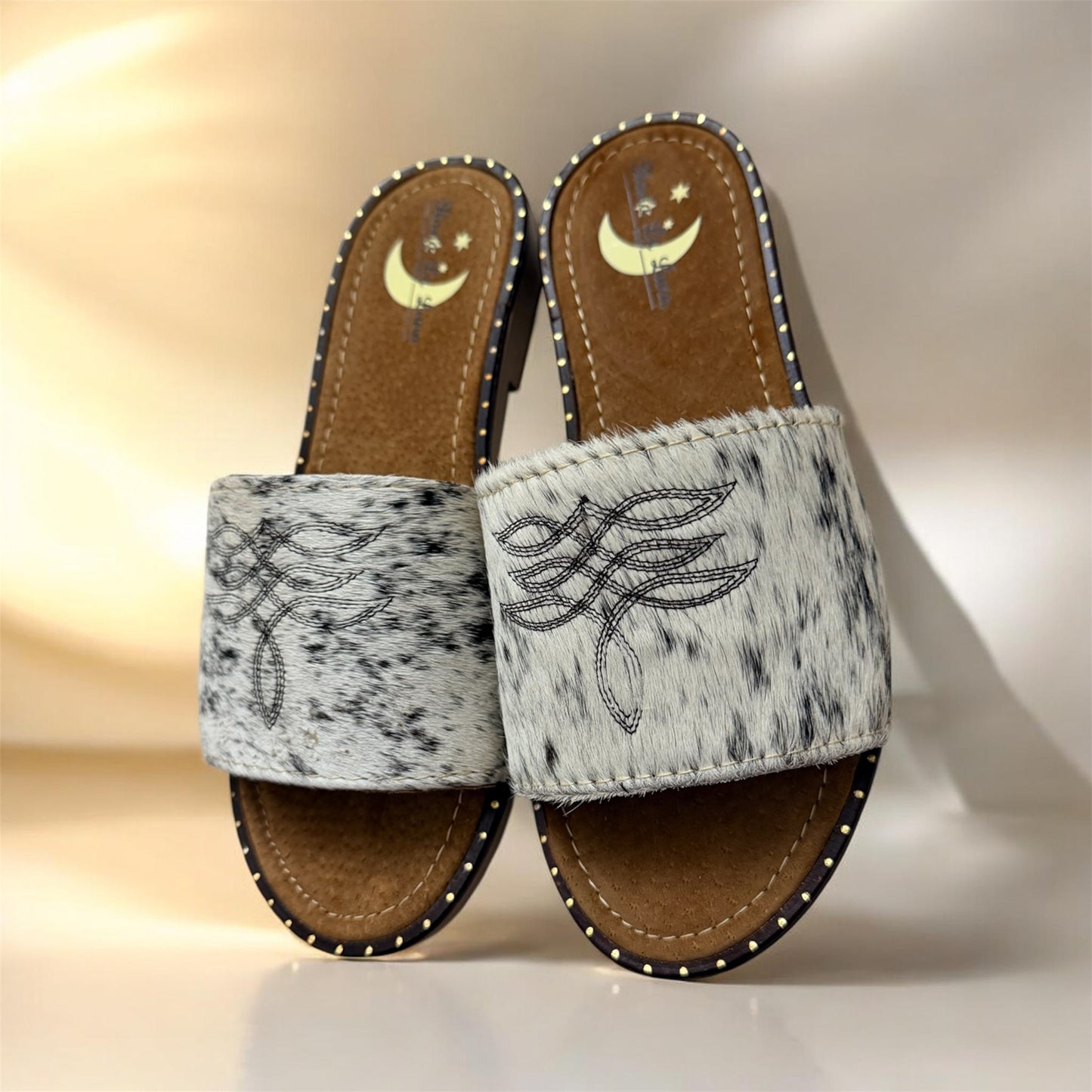 White and Black Women's Cowhide Sandals (size 7)