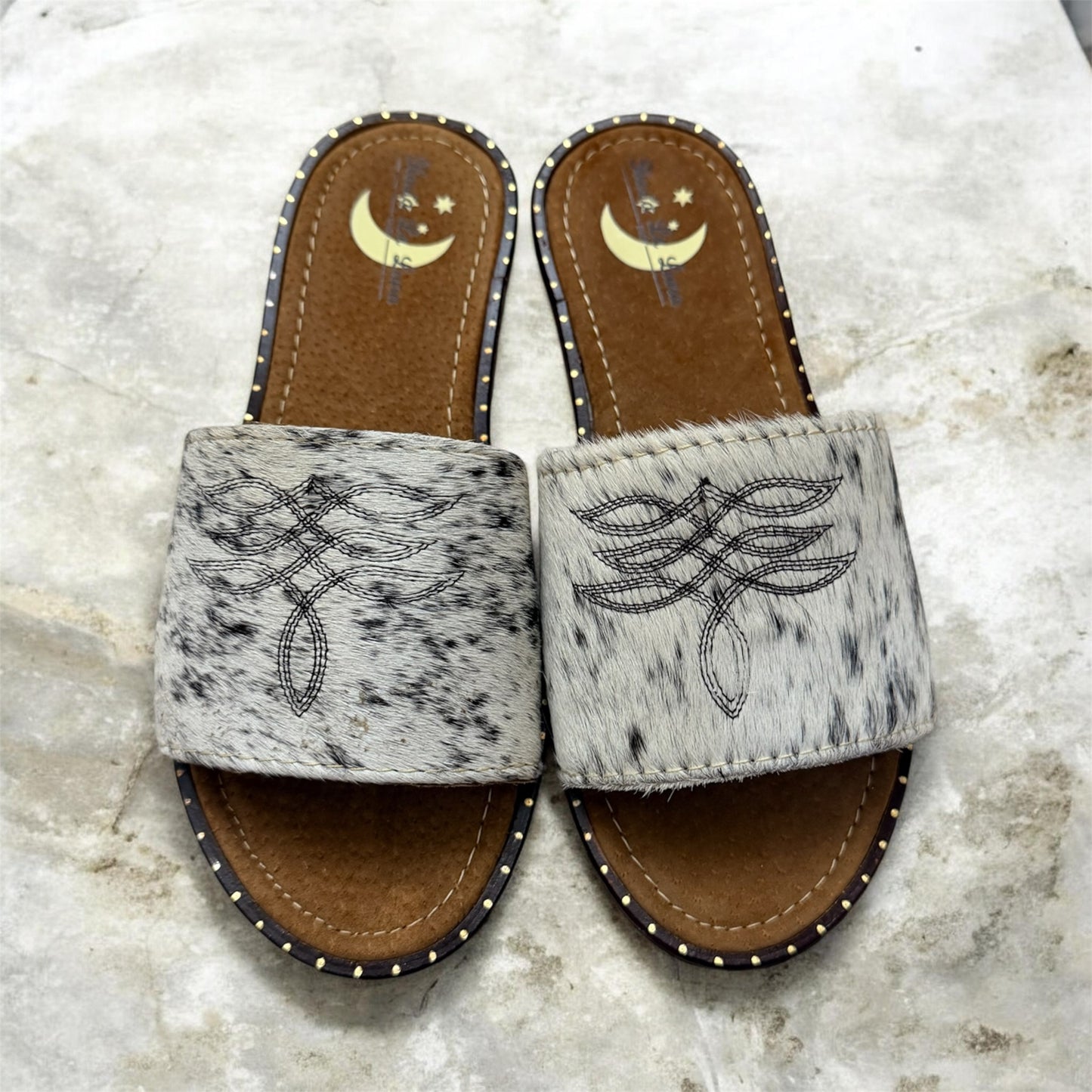 White and Black Women's Cowhide Sandals (size 7)