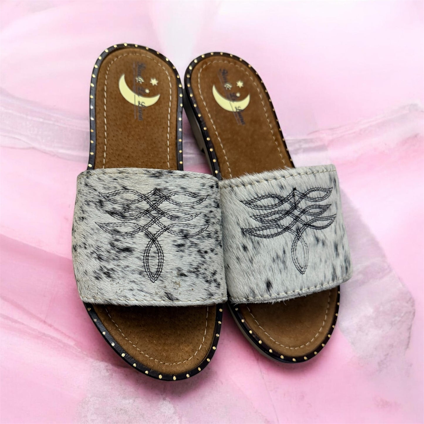 White and Black Women's Cowhide Sandals (size 7)