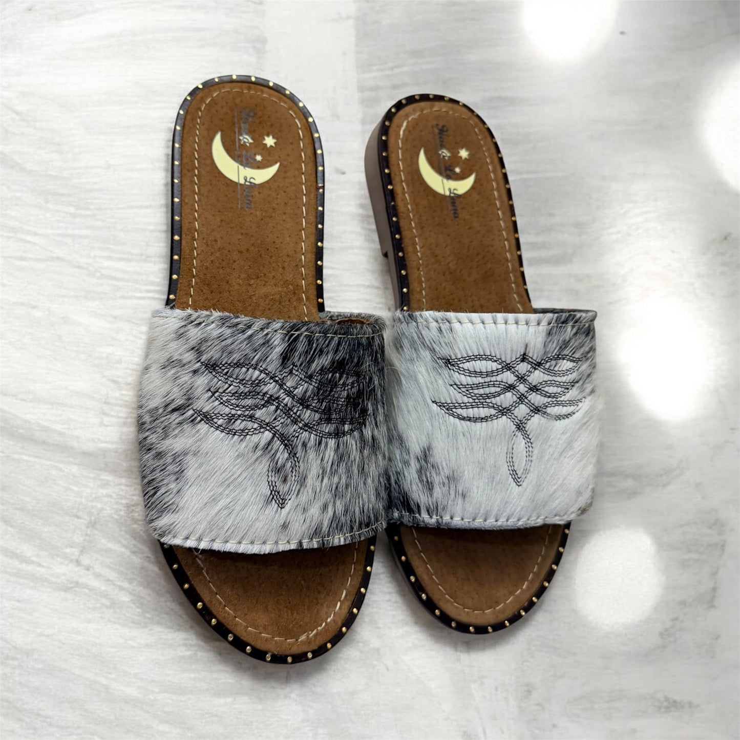 White and Dark Brown Cowhide Sandals (size 8)
